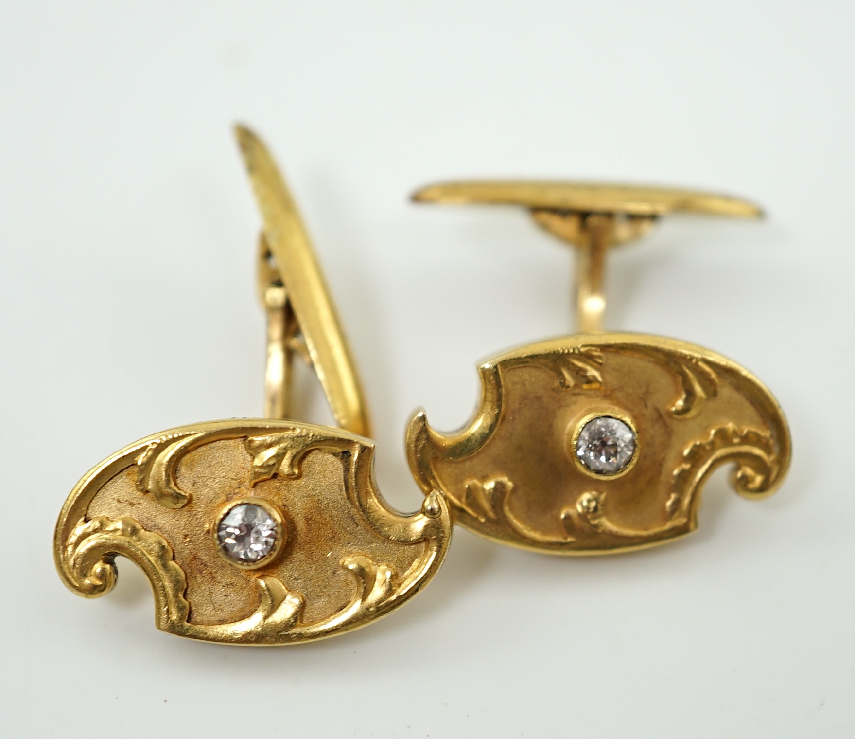 A pair of Russian 56 zolotnik gold and solitaire diamond set cufflinks